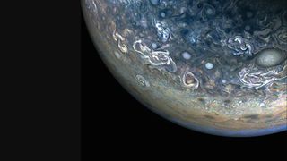 Jupiter's chaotic clouds and cyclonic storms, in an area known as a folded filamentary region, shine in a photo captured by NASA's Juno probe on May 12, 2024.