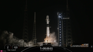 A SpaceX Falcon 9 rocket launching at night from a Florida pad 